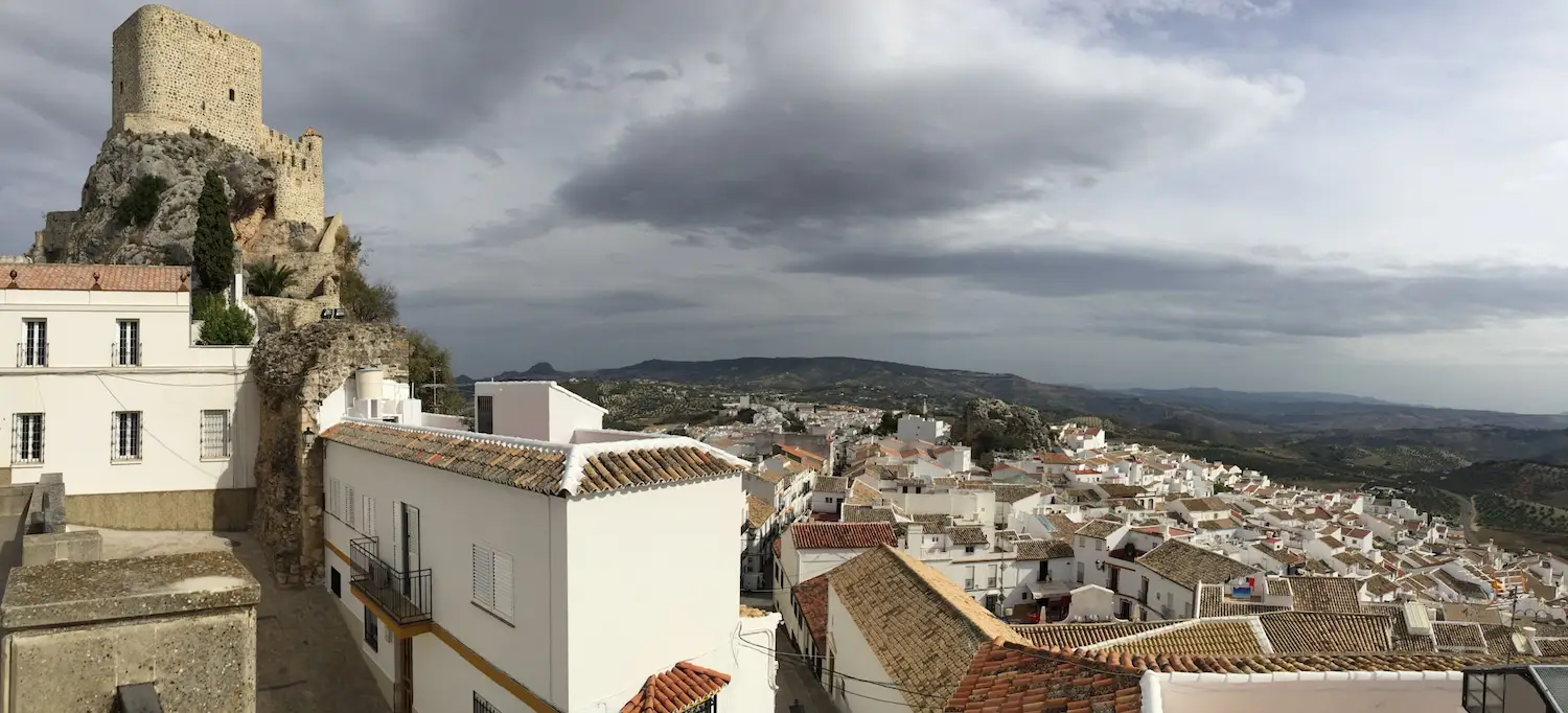 Spanish white village under cloudy skies