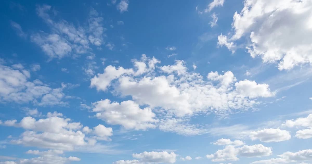 Malaga weather in October with mild autumn sky and soft scattered white clouds, bright but softer lighting on Costa del Sol