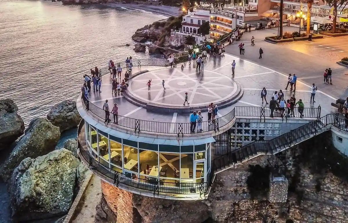 View of Nerja's Balcon de Europa clifftop promenade with the Mediterranean Sea and coastline below