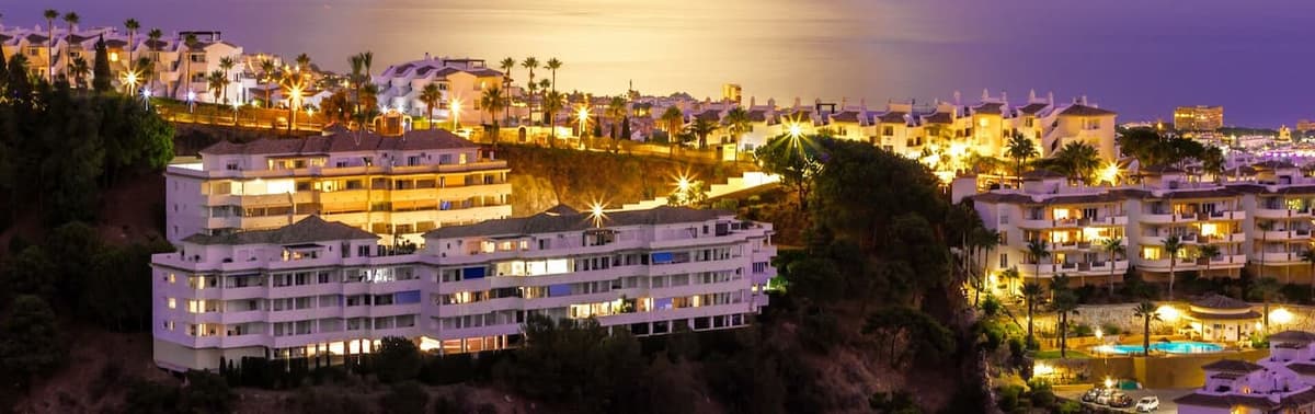 Marbella Old Town plaza with orange trees and white buildings