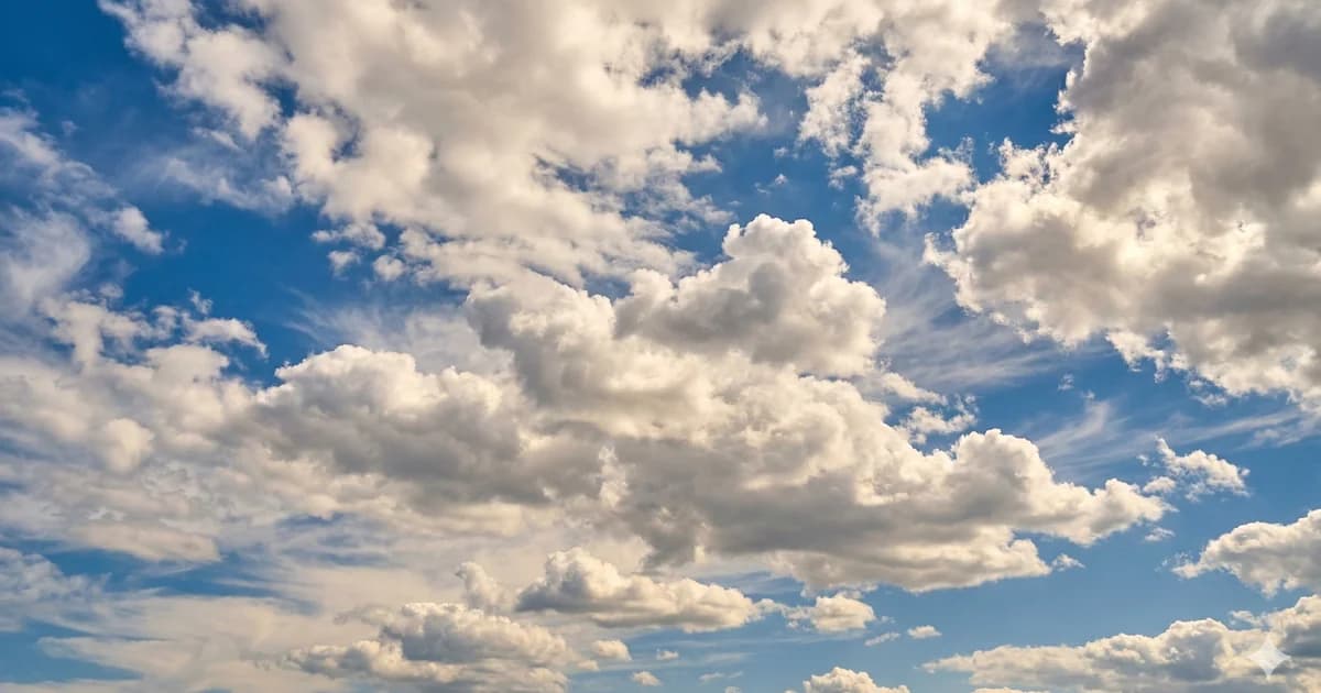 Malaga weather in May with bright blue skies and fluffy white clouds, perfect summer conditions on Costa del Sol