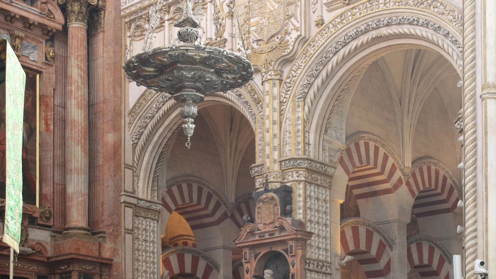 Interior of the Mezquita-Catedral de Córdoba – rows of striped red-and-white arches extending into the distance