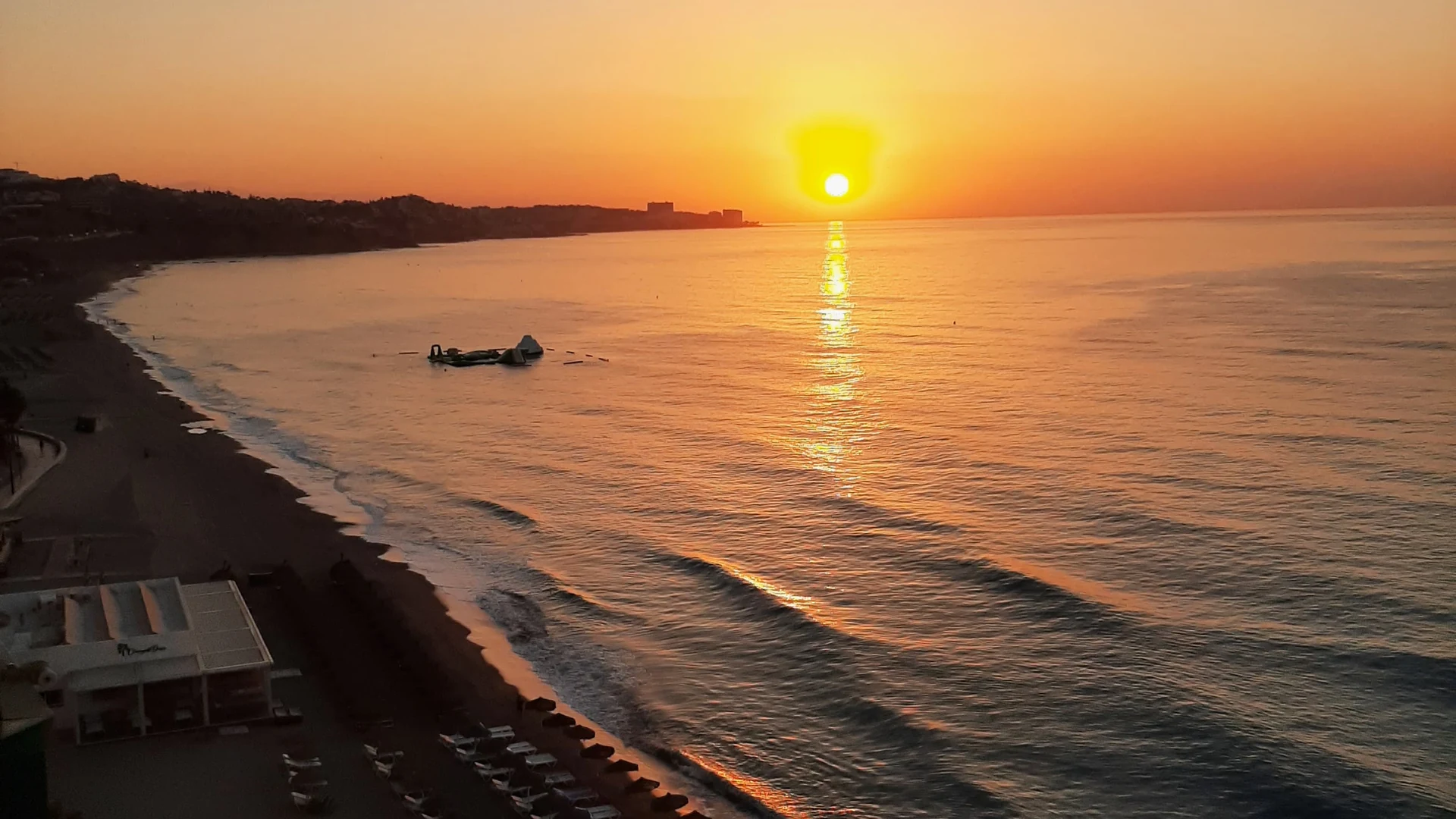 Sunrise over the beach at Fuengirola with golden light across the sea