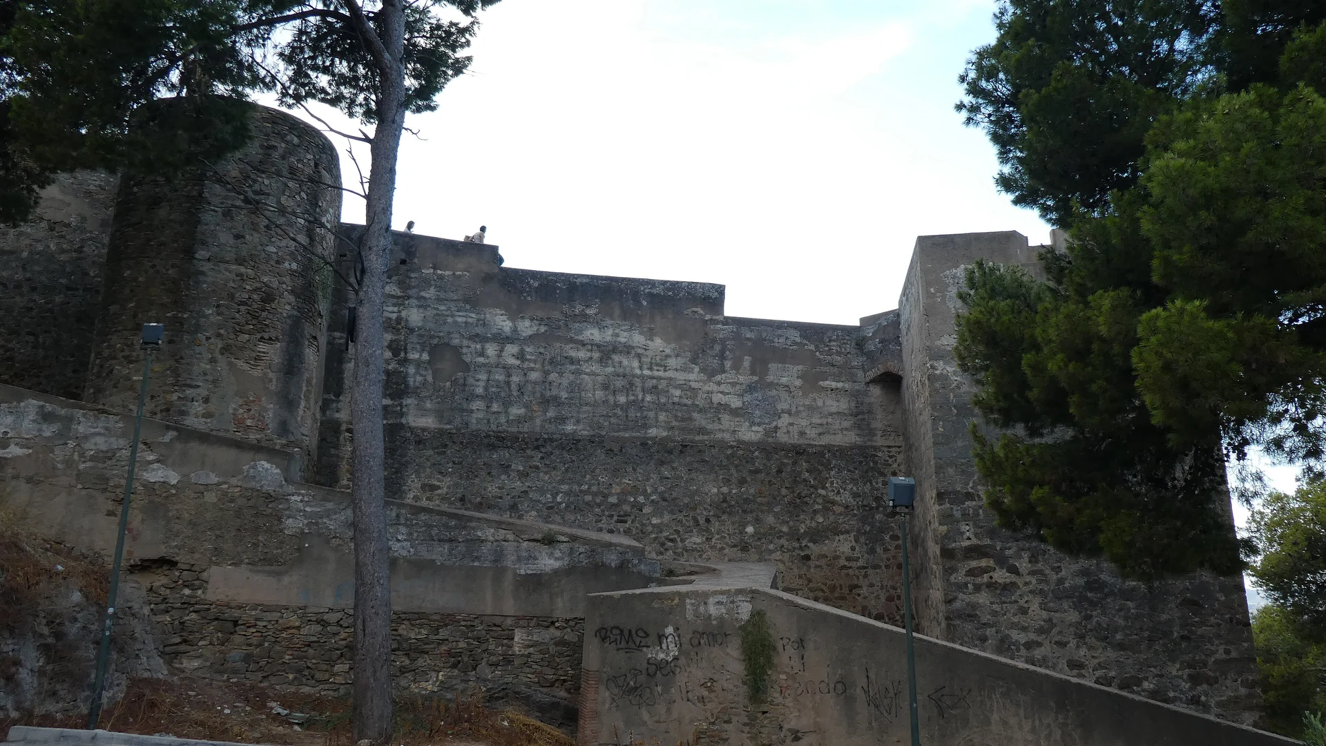 The ramparts and walls of Gibralfaro Castle on the hill above Malaga