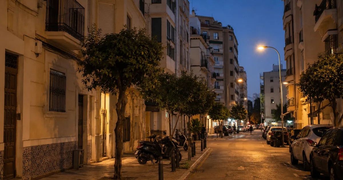 Málaga city evening street with illuminated residential buildings and calm urban atmosphere representing safety for expats