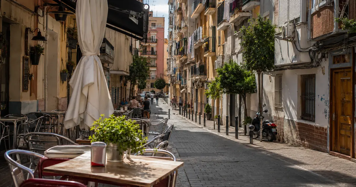 Everyday Málaga street scene with café terrace, apartments and local urban life