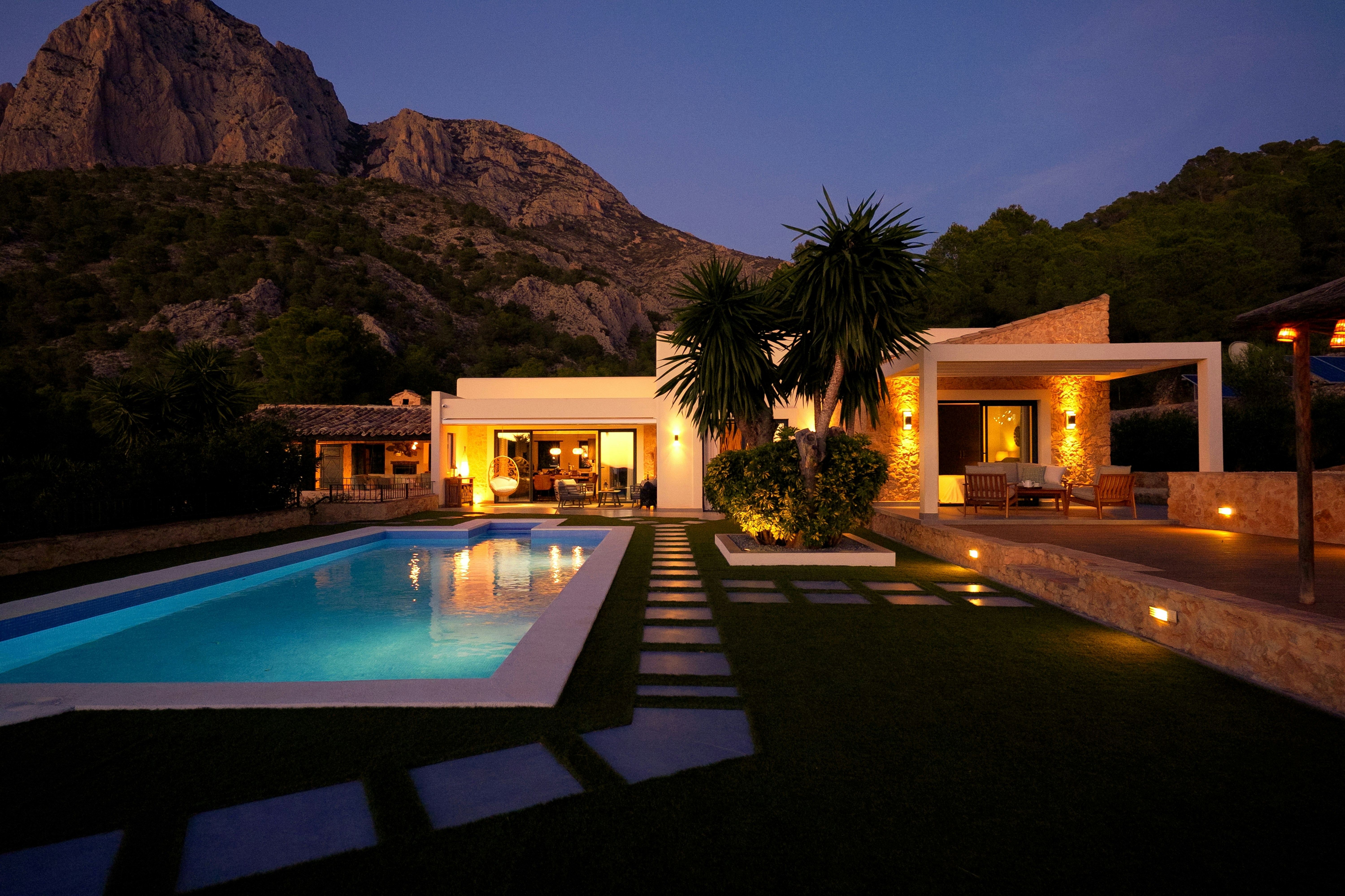Luxury holiday villa rental in Spain with private pool and mountain views at dusk