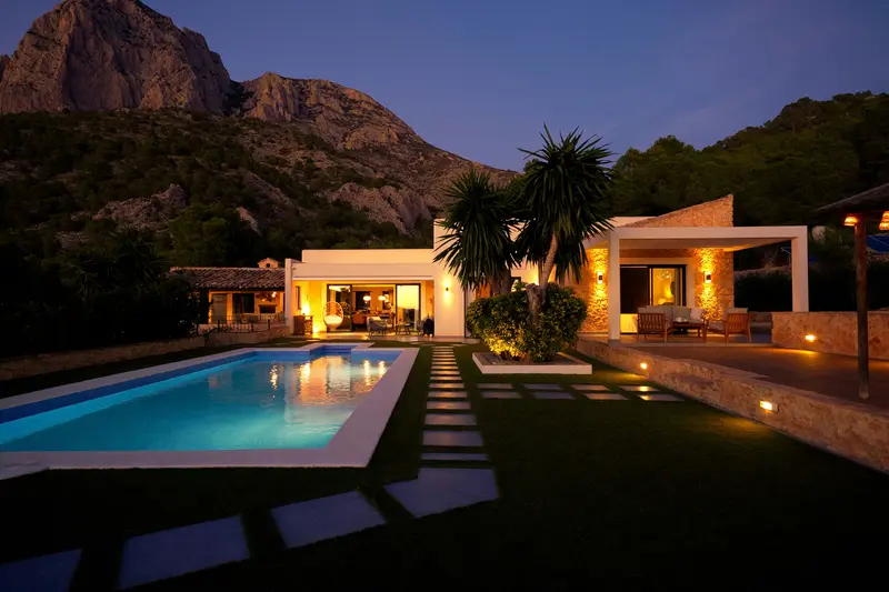 Luxury holiday villa rental in Spain with private pool and mountain views at dusk