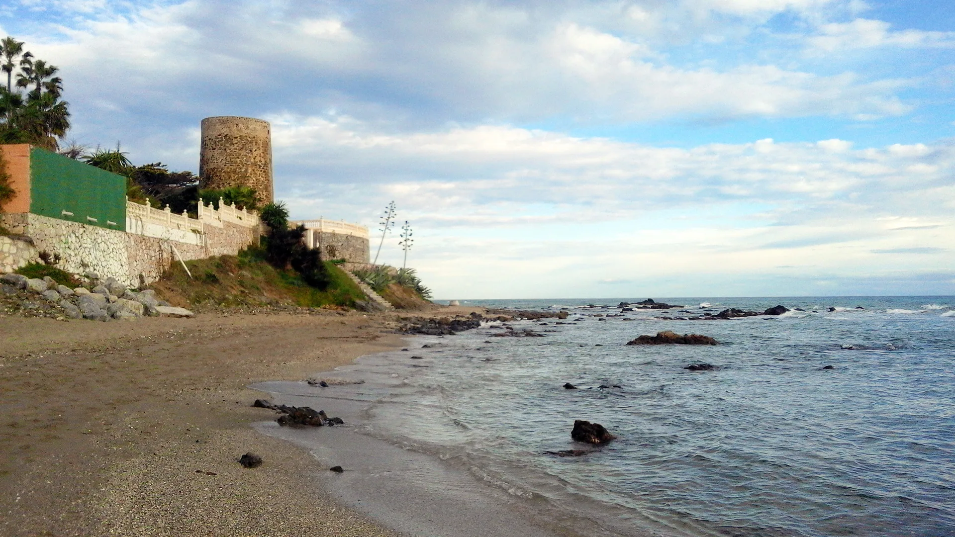 The Torre de Calahonda watchtower above the beach on the Mijas Costa coastline