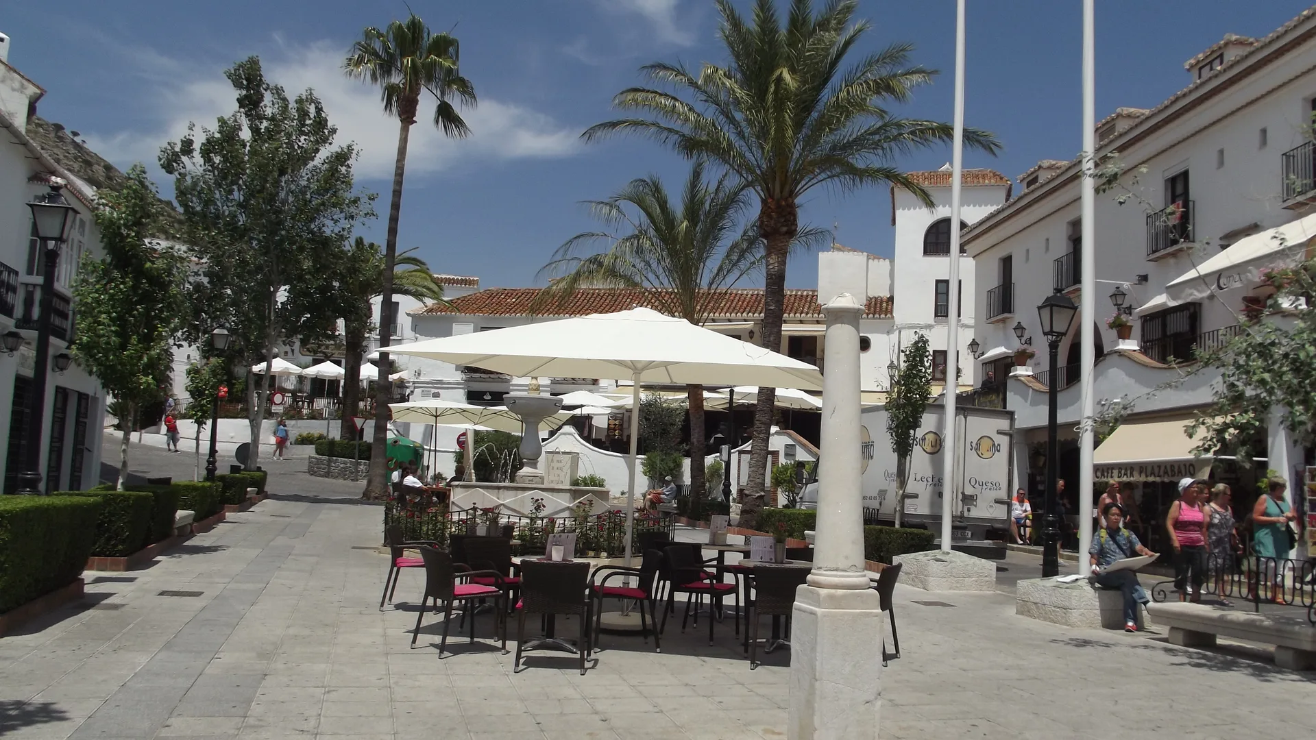 Café tables and a fountain in Plaza de la Constitución, Mijas Pueblo