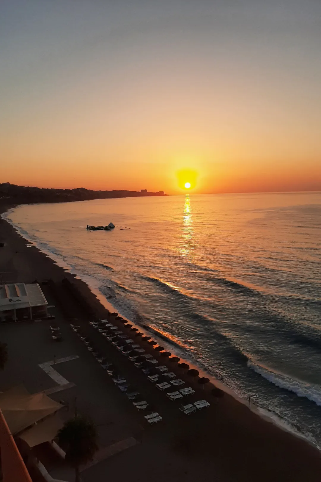 Sunrise over the beach at Fuengirola with golden light across the sea