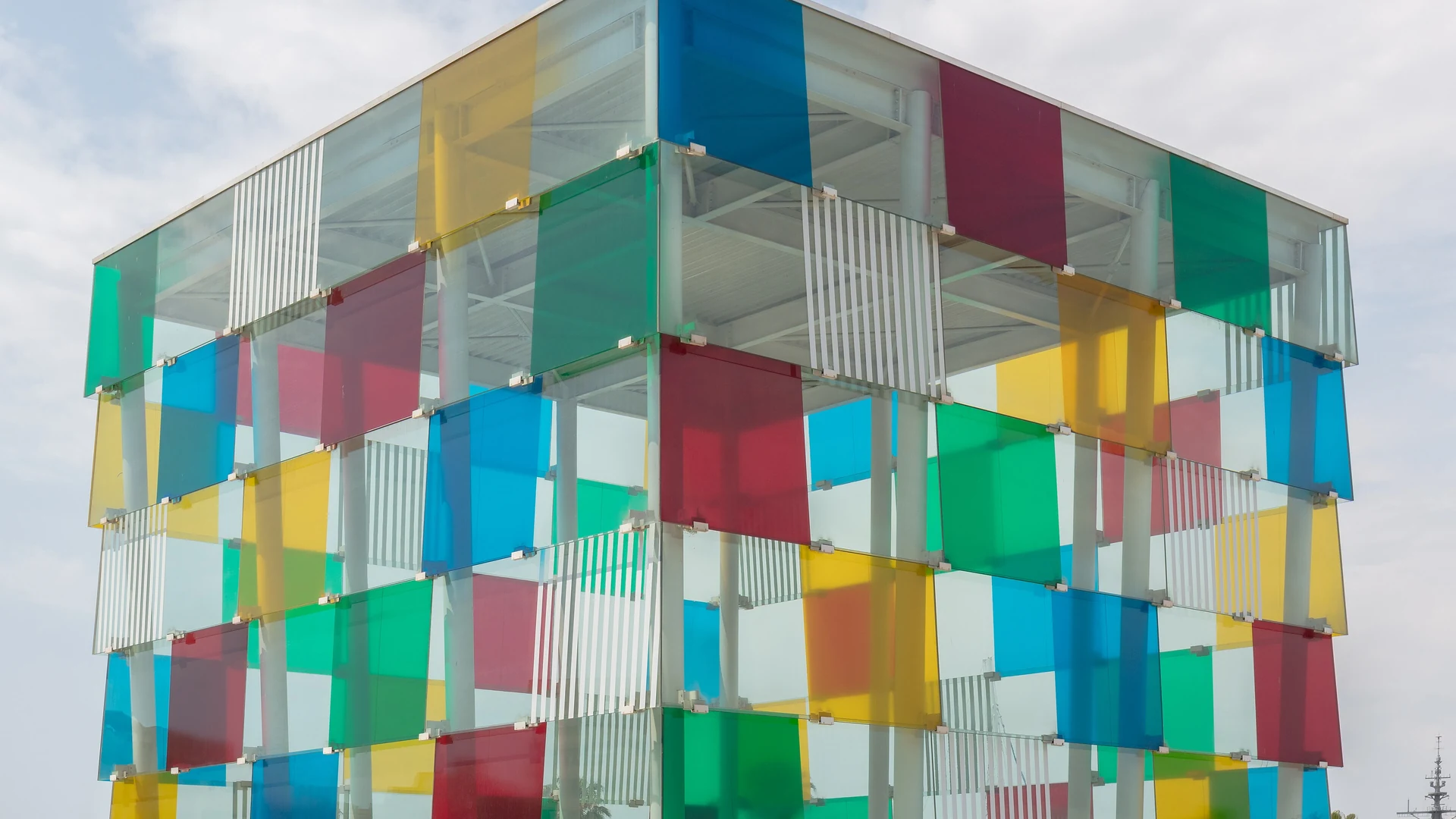 The coloured glass cube of the Centre Pompidou Málaga on the waterfront at Muelle Uno
