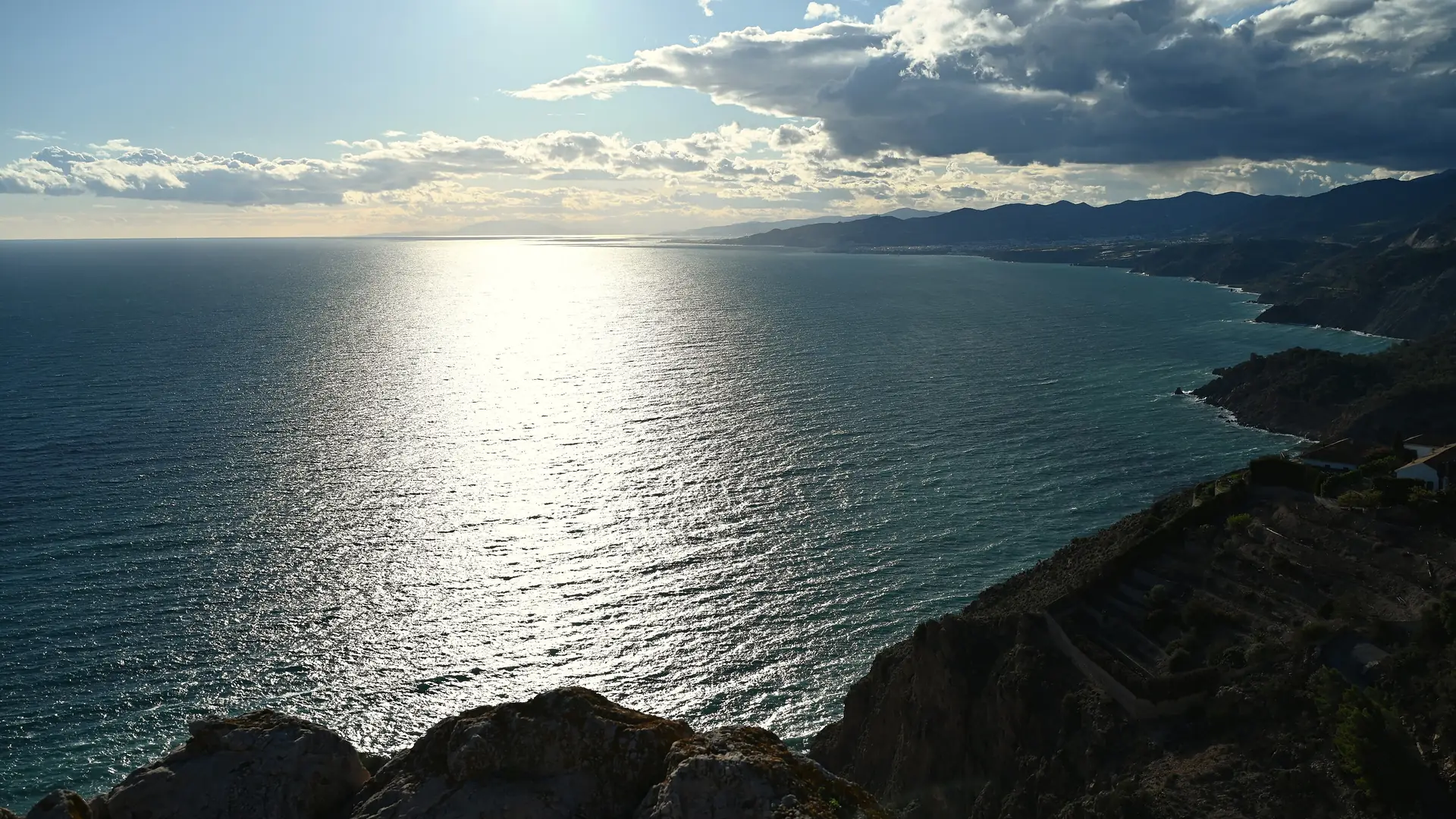 Turquoise sea below the dramatic Maro cliffs near Nerja, a protected stretch of coast paddled by kayak