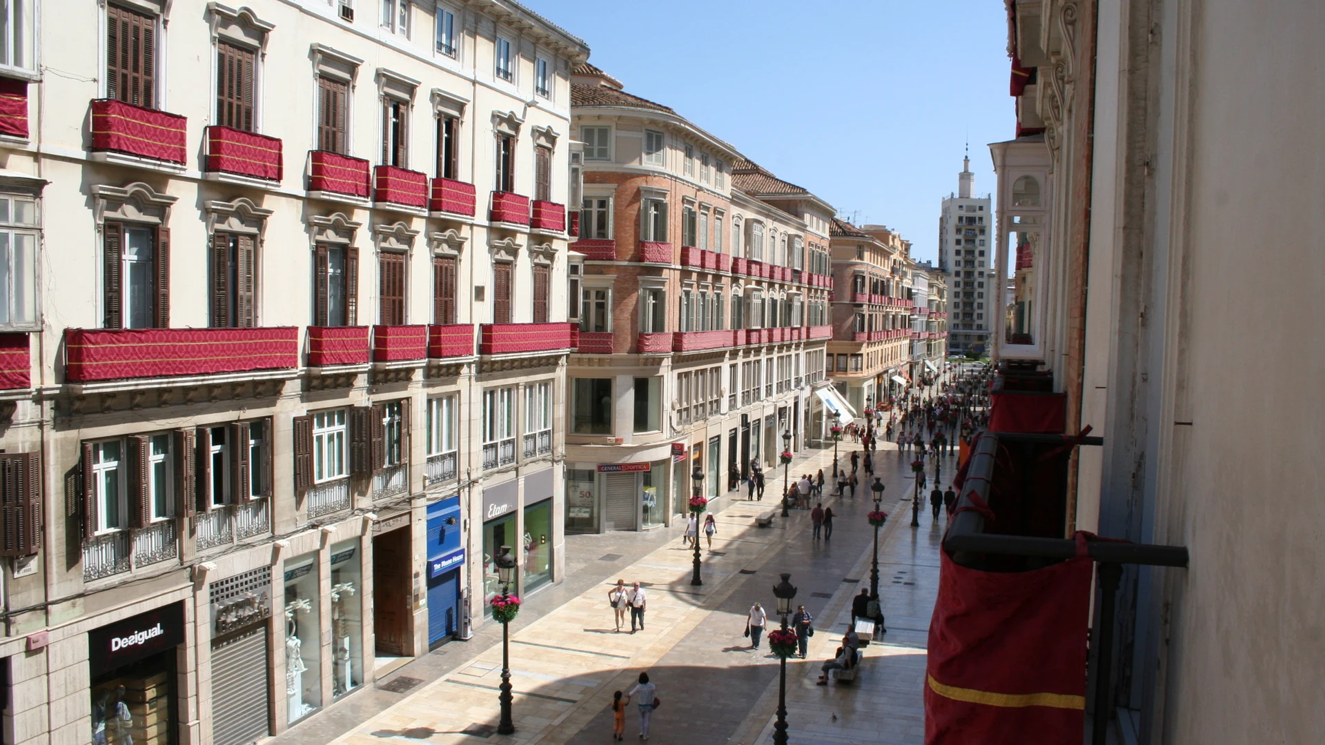 People walking the pedestrianised Calle Larios in Malaga's old town