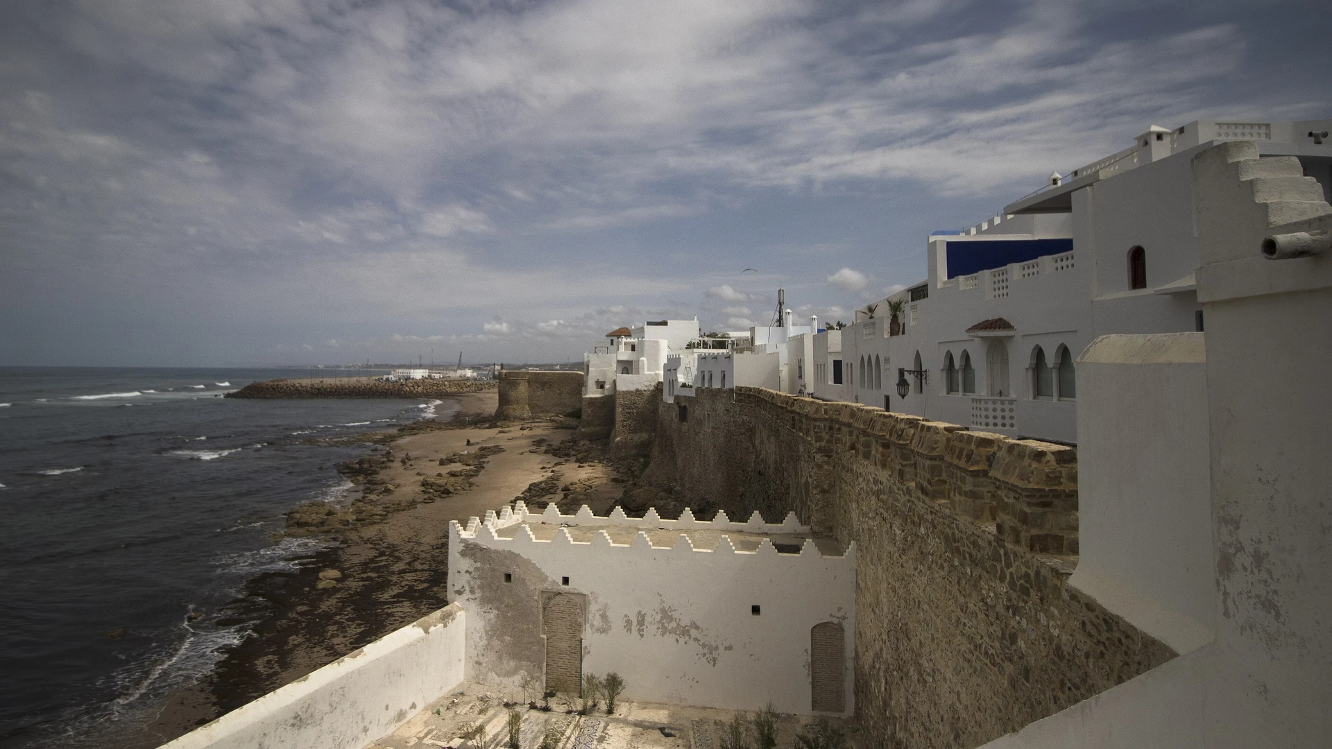 Panoramic view of Tangier, Morocco, with the white city and port spread across the hillside above the Strait of Gibraltar