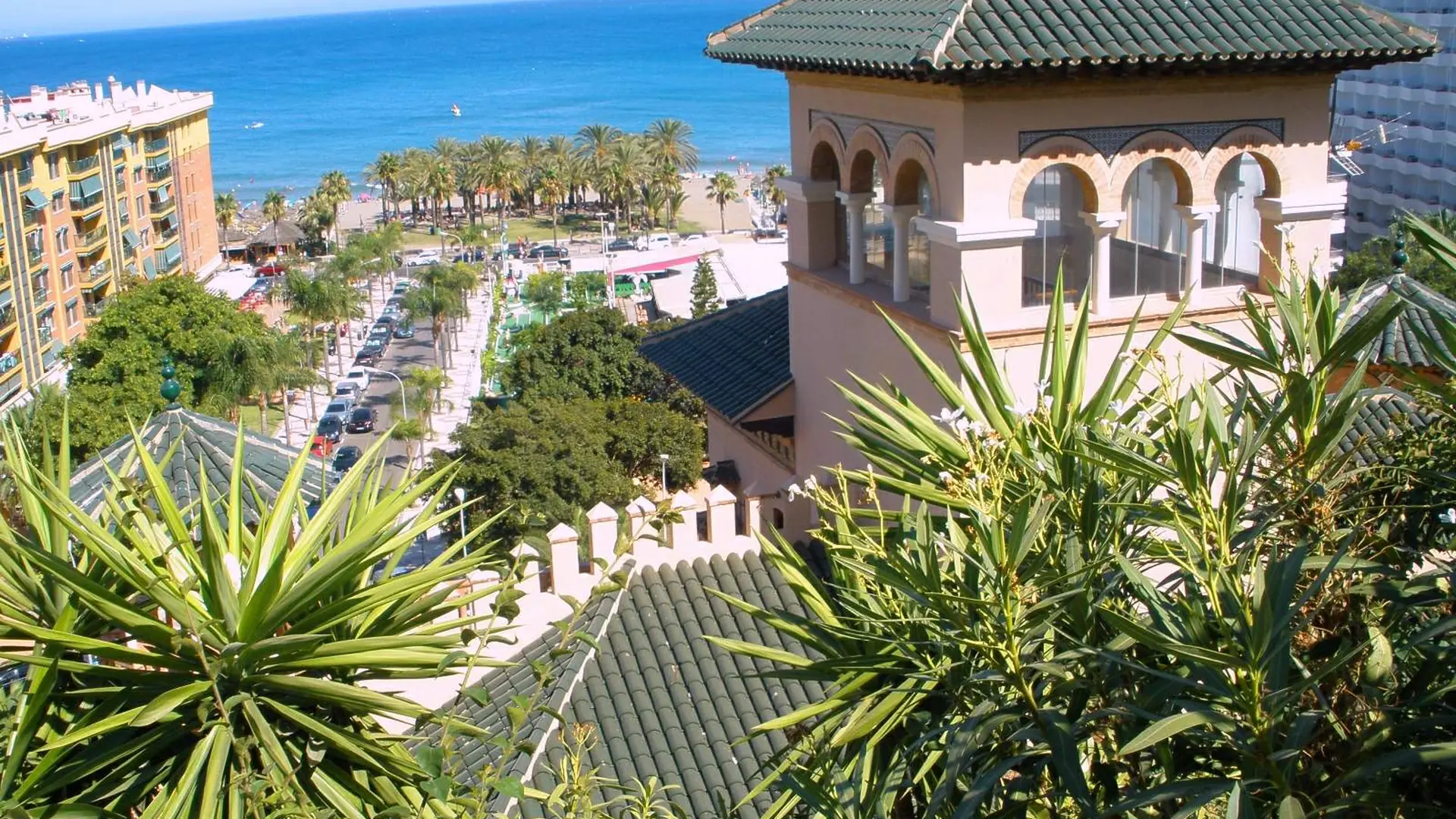 View over the tiled tower of Casa de los Navajas to the sea and the Torremolinos seafront