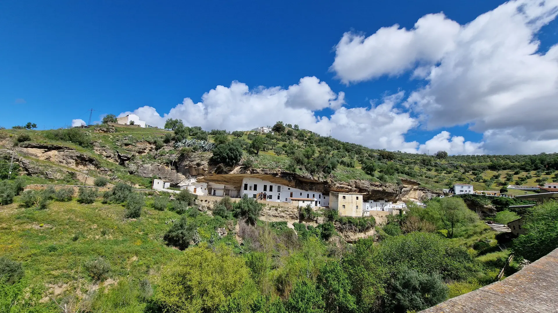 White houses built under an overhanging rock at Setenil de las Bodegas, a day trip from Torremolinos