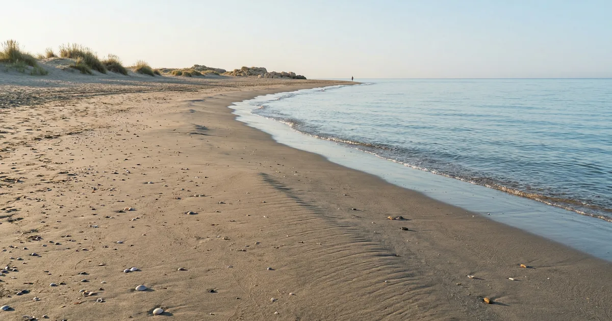 Quiet beach in Torremolinos with calm sea and no sunbeds
