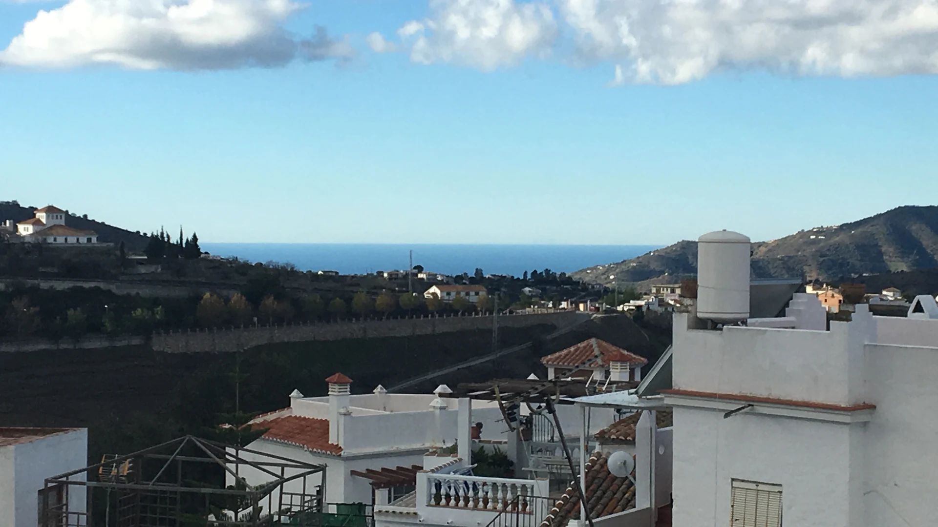 View over the Axarquía valley and Mediterranean from the white mountain village of Cómpeta