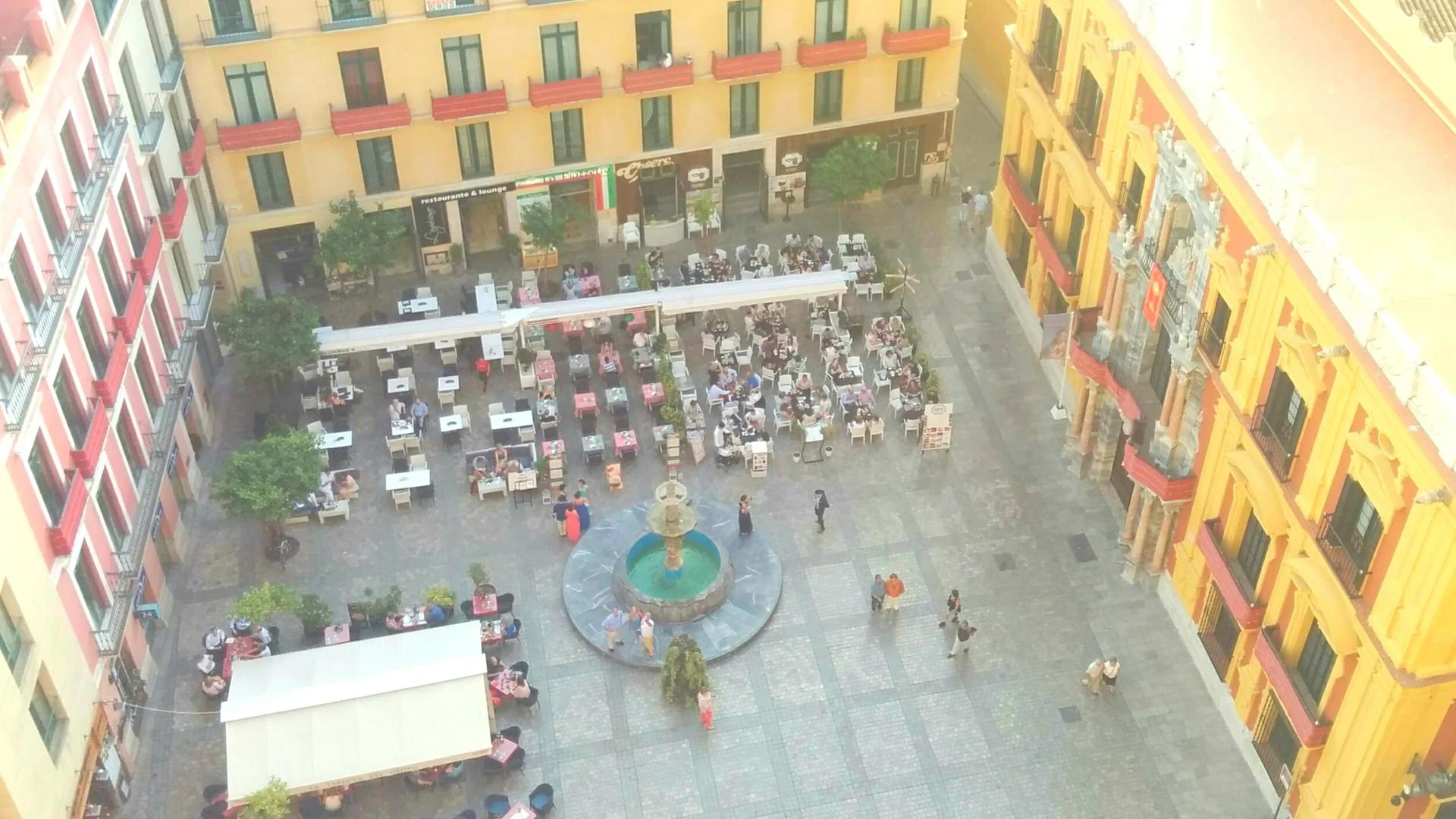 Café terraces around the fountain on Plaza del Obispo in Malaga's old town