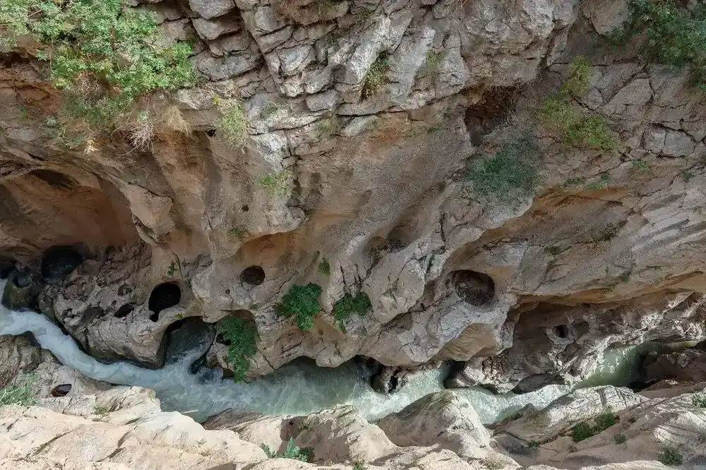 Looking straight down to the Guadalhorce River from the Caminito del Rey, around 100 metres above the water