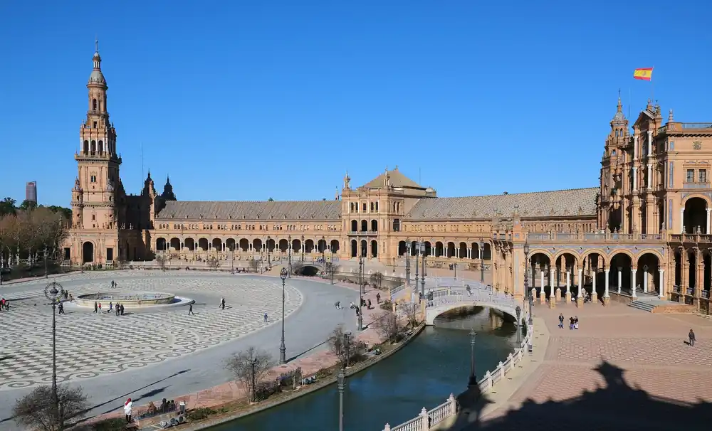 The grand semicircular Plaza de España in Seville with its canal and towers
