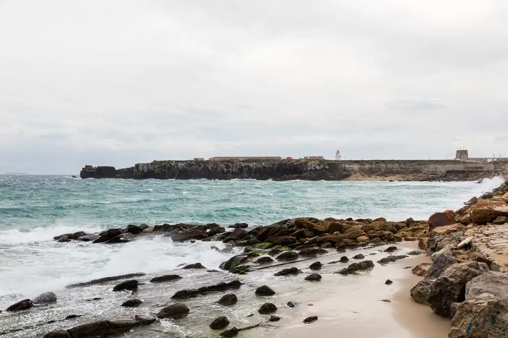 The beach and Isla de Tarifa at the southern tip of Spain where the Atlantic meets the Mediterranean